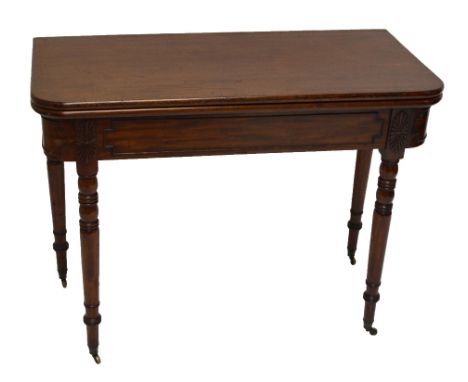 An early 19th century mahogany foldover tea table with rounded top, 100x100cm when extended, on full ring turned legs with ca