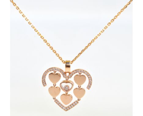 CHOPARD; an 18ct rose gold open frame heart shaped pendant centred with a glazed compartment containing a round cut melee dia
