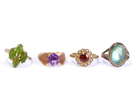 A 9ct yellow gold floral seed pearl set ring, size K 1/2, a 9ct yellow gold dress ring with pale purple coloured stones, size