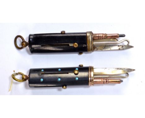 A propelling four piece gun metal etui with yellow metal collar and set with tiny turquoise cabochons, comprising knife, penc