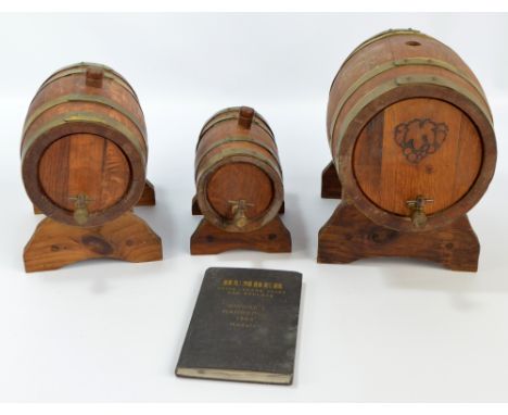 Three vintage brass bound wine casks of graduating size on stands (3).