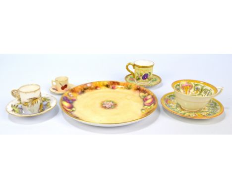 A Royal Worcester fruit painted plate by S. Roberts, black printed mark to base, diameter 24cm and four cups and saucers (5).