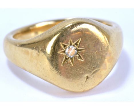 A 9ct yellow gold gentleman's signet ring, set with a small diamond, size T, approx 11.7g.