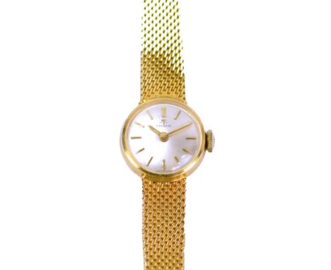 TISSOT; a lady's vintage 18ct yellow gold wrist watch with circular dial set with gold batons and integral bracelet, total ap