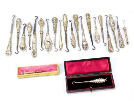 A quantity of small button hooks, probably for gloves, with hallmarked silver sheath handles, including two boxed examples, f