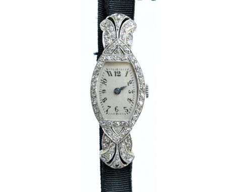 An Art Deco platinum cased manual wind lady's cocktail wristwatch set with numerous diamonds to the hinged shoulders and to t