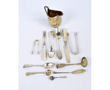 A mixed group of silver including a pair of fiddle pattern dessert spoons, London 1848, a Georgian cream jug (badly af), sift