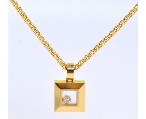 CHOPARD; an 18ct yellow gold framed square pendant with glazed aperture containing a round cut melee diamond bezel setting, s