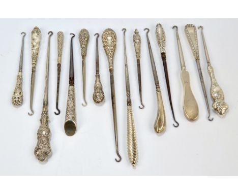 Fifteen medium sized and small button hooks with hallmarked silver sheath handles, including engine turned examples, wrythen 