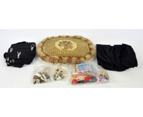 A quantity of sewing related items to include needlework cushion, embroidery silks, buttons etc.