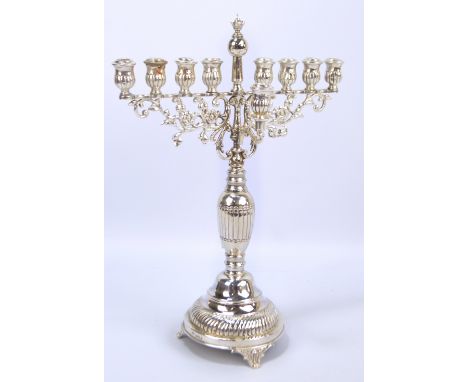 J ZEVING (OR JOSEPH ZWEIG); a George V hallmarked silver Hanukkah menorah with cast foliate scroll and floral motifs to upper