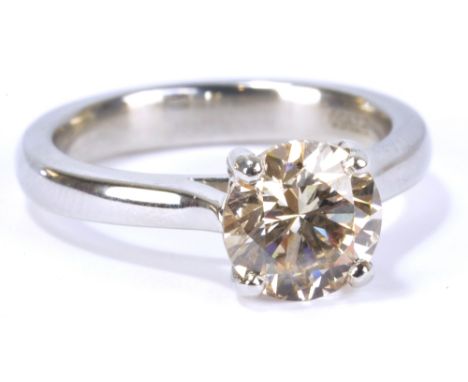 A platinum and diamond solitaire ring, the round brilliant cut stone weighing approx 2.01ct, in four claw setting, size M, ap