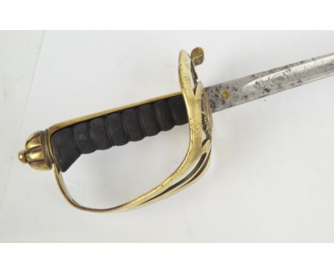 A late 19th century Irish sword with shagreen grip, pierced knuckle guard, engraved tapering blade and leather scabbard, leng