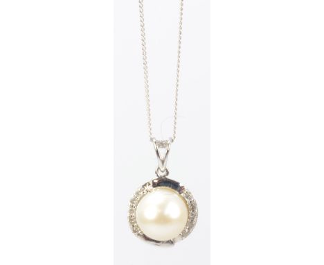 A 9ct white gold fine link chain supporting a circular tiny diamond and cultured pearl set circular pendant.