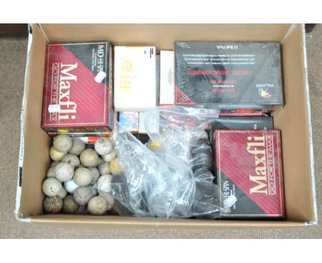 A quantity of vintage golf balls, practice balls, fives ball, more modern boxed balls, etc.