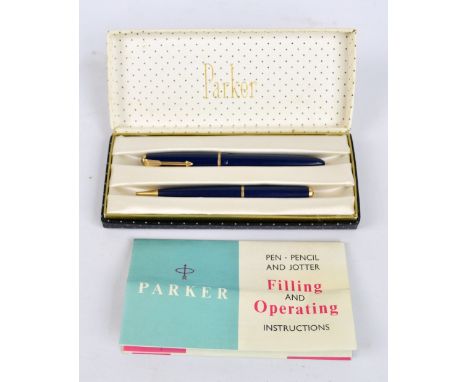 A boxed Parker 'Slim Fold' fountain pen with 14ct yellow gold nib and a matching propelling pencil number 3, with manual.