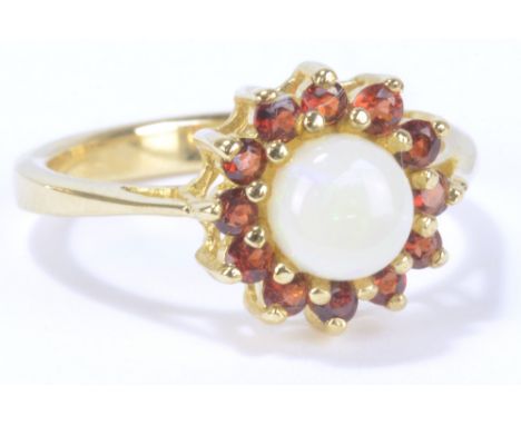 A 9ct yellow gold opal and garnet floral cluster ring, size N1/2, approx 2.9g.