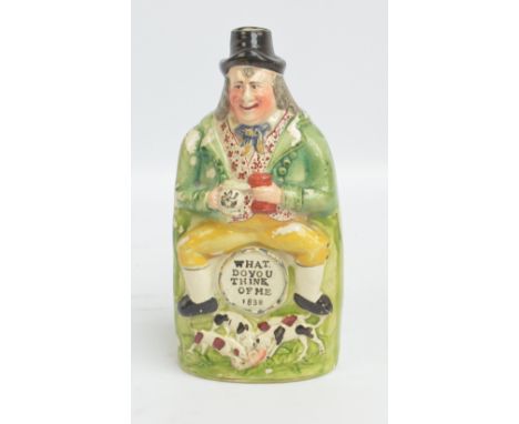 An early to mid-19th century reform flask modelled as a man seated upon a barrel, polychrome painted and decorated, inscribed