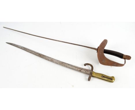 A 19th century French Chassepot bayonet with curved blade and ribbed brass grip, indistinctly stamped to the blade, length 70