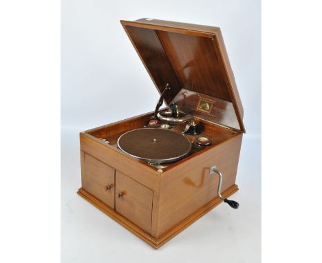 A walnut cased Italian HMV table top gramophone with transferred detail of the dog seated beside a gramophone inscribed 'La V