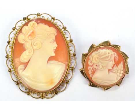 A 9ct gold framed oval cameo brooch with a filigree decorated frame and central oval portrait classical bust, 5.5 x 4.5cm, an