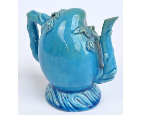 A 19th century turquoise glazed Cadogan type teapot with typical moulded spout, handle and spreading circular base, height ap