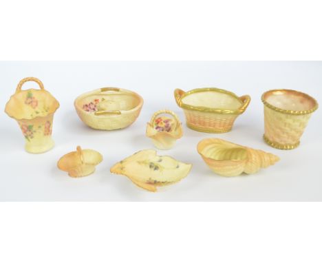 A collection of various Royal Worcester blush ivory predominantly wicker effect decorated items to include a miniature basket