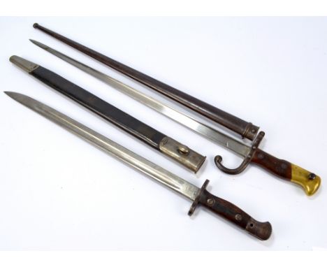 A late 19th century French Chassepot bayonet with metal scabbard, length 66cm and a further bayonet with leather and metal mo