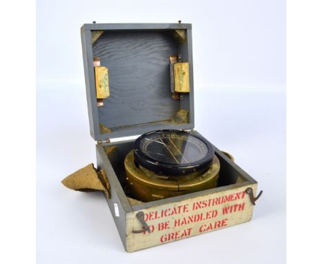 A boxed WWII aircraft compass, the top stamped 'Type P.H. No.83061D', the brass body with applied plaque imprinted 'A M Ref 6