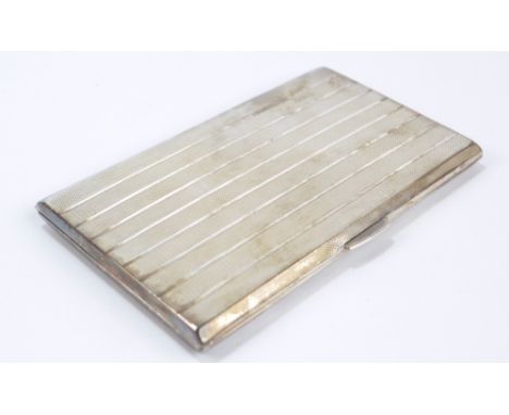 A George VI hallmarked silver rectangular cigarette case with engine turned decoration and presentation inscription to interi