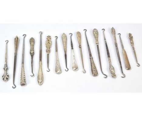 Fifteen small button hooks with hallmarked silver sheath handles, including two pierced examples, two plain examples, an exam
