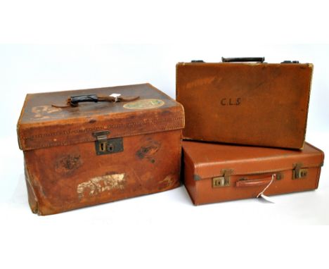 A vintage leather travelling case with Salisbury Hotel sticker, initialled A J L, 46 x 36 x 26cm, and two small suitcases (3)