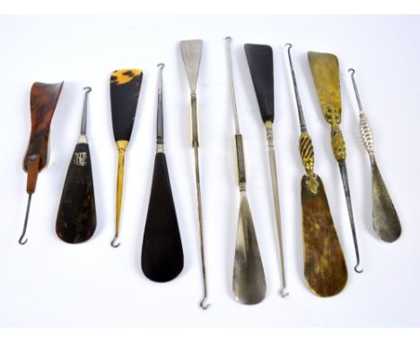 A small collection of combination button hook and shoe horns including a faux tortoiseshell example with silver gilt collar, 