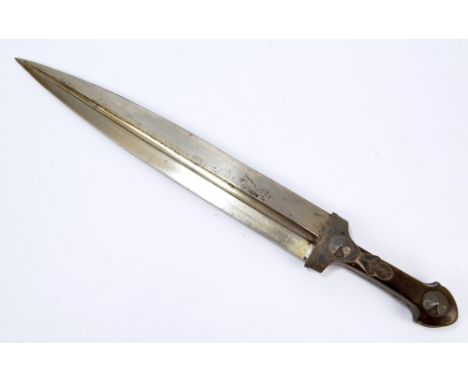 A 19th century dirk with shaped wooden handle set with engraved metal mounts and fluted blade (lacking scabbard), length 47.5