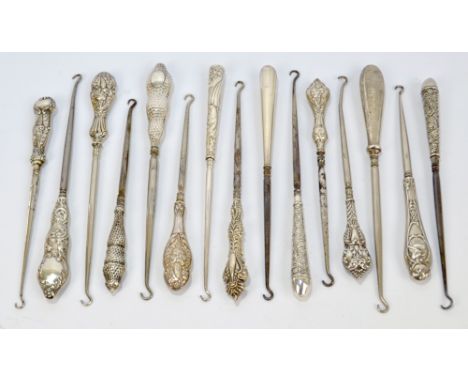 Fifteen medium sized button hooks with hallmarked silver sheath handles, including engine turned examples, examples with ange