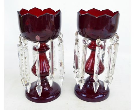 A pair of Victorian ruby glass table lustres with clear glass prisms, shaped tops and circular feet, height 34.5cm.   CONDITI