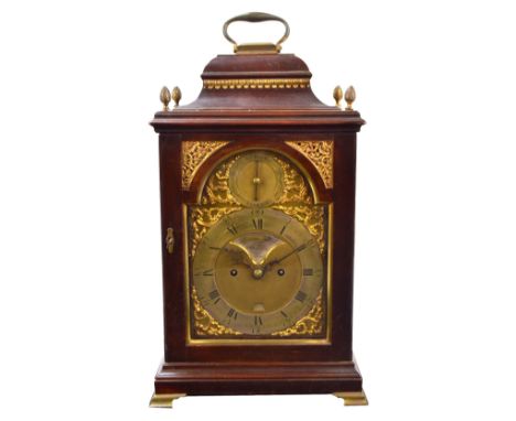 A good George III mahogany and brass detailed repeating bracket clock, the swing loop handle above domed canopy and brass fin