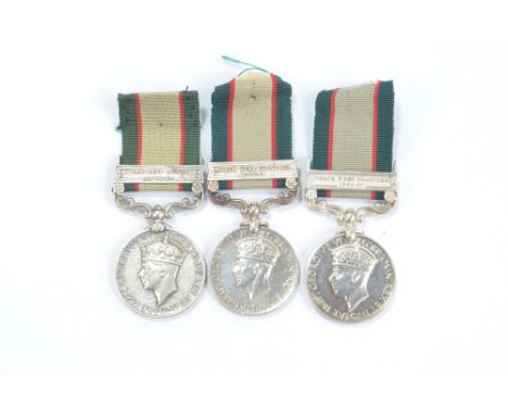 Three India General Service Medals, North West Frontier 1936-37 bars; A. & S. H., 2979156 Pte. W. Logue and 2979350 Pte. D. D