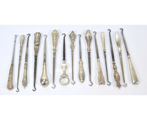 Fifteen small button hooks with hallmarked silver sheath handles, including a squared example with coiled linear decoration, 