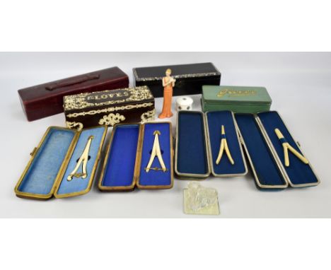 A collection of vintage glove boxes including a blue velvet example with cut steel mounts containing a glove stretcher, a sim