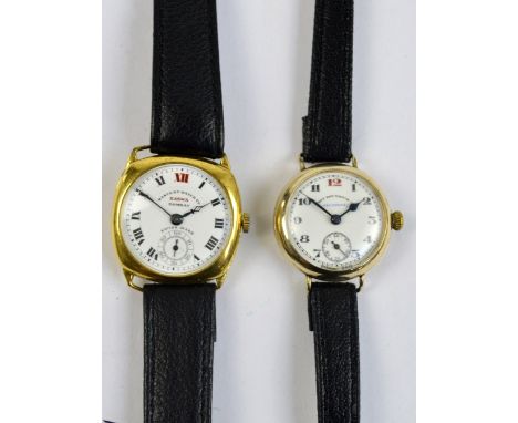 A vintage Eastern Watch Co gold plated wristwatch with shaped case and circular white enamel dial set with Roman numerals and