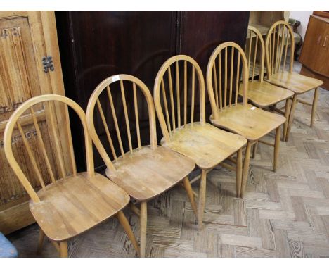 A harlequin set of six light Ercol dining chairs