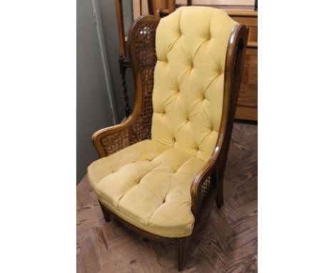 An early 20th Century French style gold upholstered button back chair