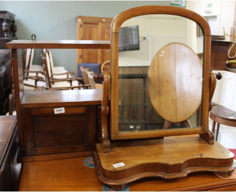 A Victorian mahogany swing toilet mirror and two door carved mahogany hanging shelves