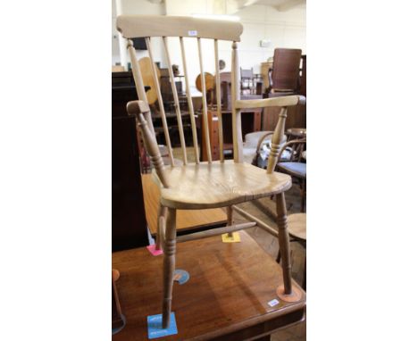 A Victorian beech and elm stick back armchair