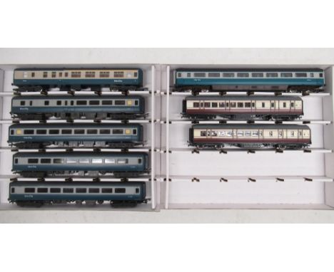 Four Mainline BR Mk2 coaches, three composite no. E5690 and one brake no. E9479; Lima OO gauge BR Mk1 brake 1st no. W16084; J