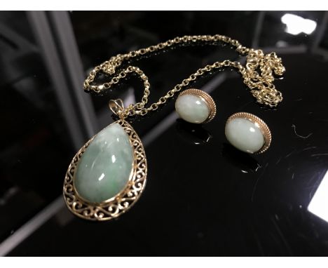 A jade pendant mounted in 9ct gold suspended upon a yellow metal chain with matching earrings. (3)