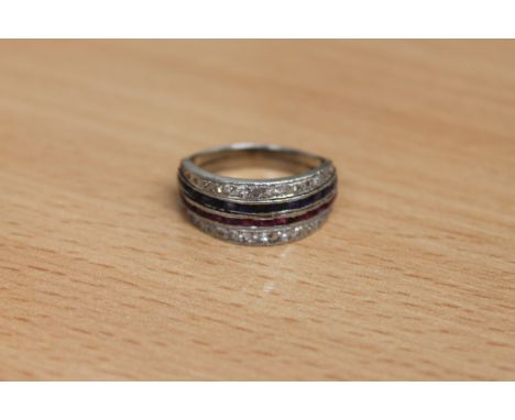 A diamond, sapphire and ruby half eternity ring, two rows of baguette-cut rubies and sapphires within borders of old-cut diam