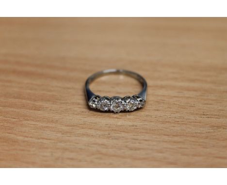 A five stone diamond ring set in 18ct white gold and platinum CONDITION REPORT: The total diamond weight is approximately 0.5