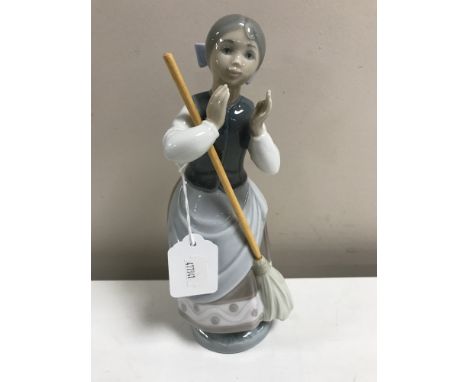 A Lladro figurine : A Clean Sweep, model 5025, height 24 cm, boxed. 